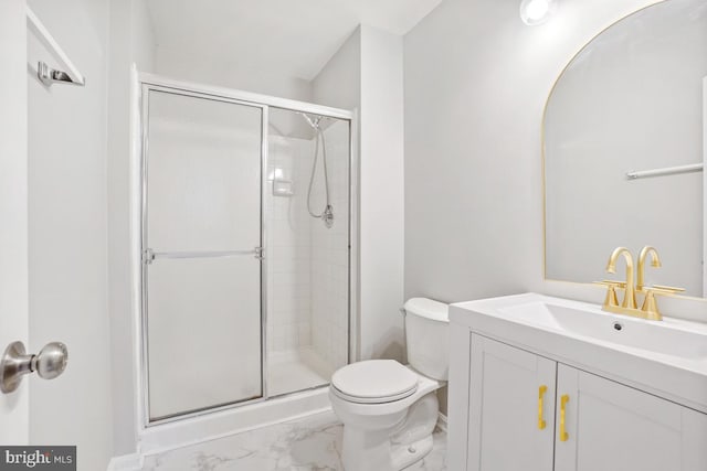 bathroom featuring vanity, an enclosed shower, and toilet