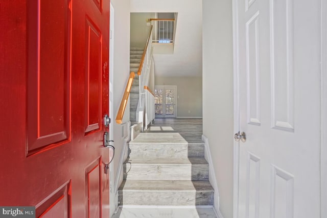 staircase featuring hardwood / wood-style flooring