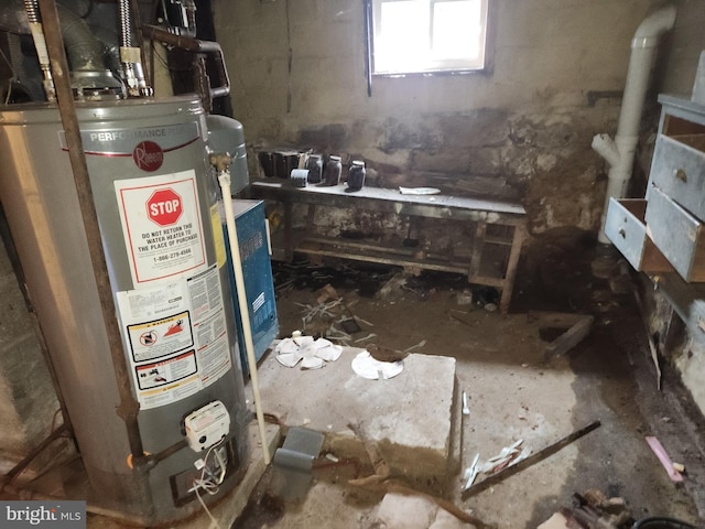 utility room featuring water heater