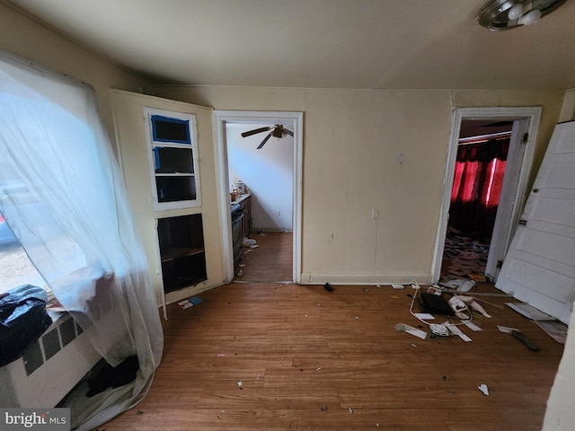 unfurnished bedroom with wood-type flooring and a closet