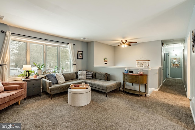 living room featuring carpet and ceiling fan