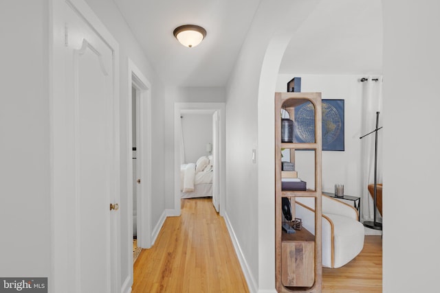 corridor with light wood-type flooring