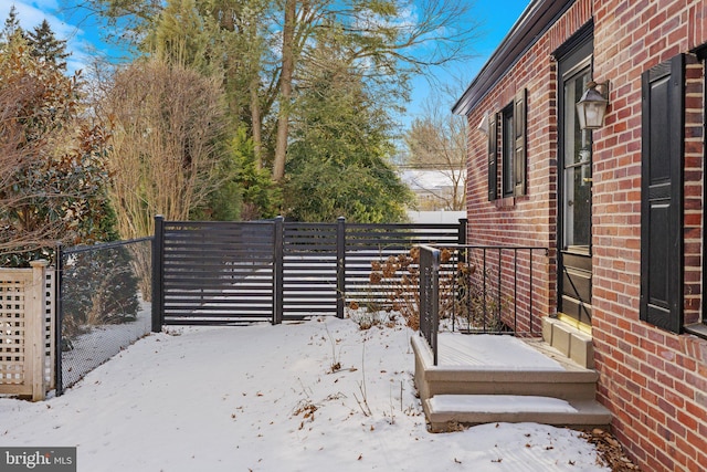 view of yard layered in snow