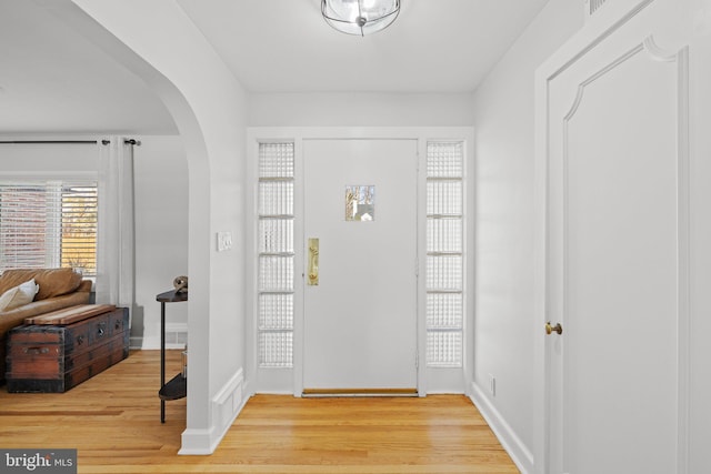 entryway with wood-type flooring