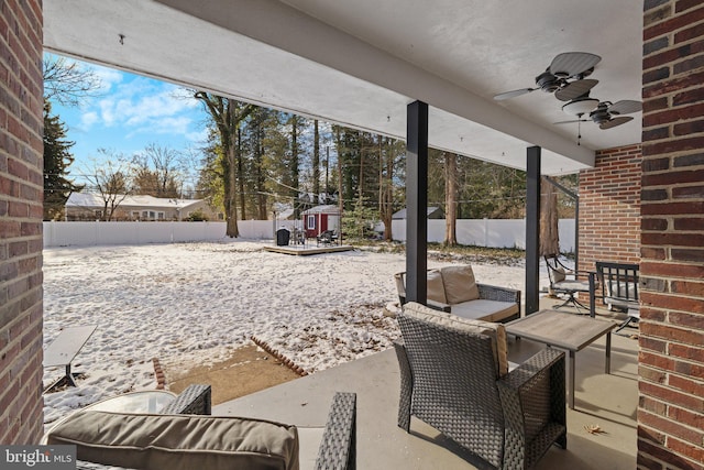 view of patio with outdoor lounge area and ceiling fan