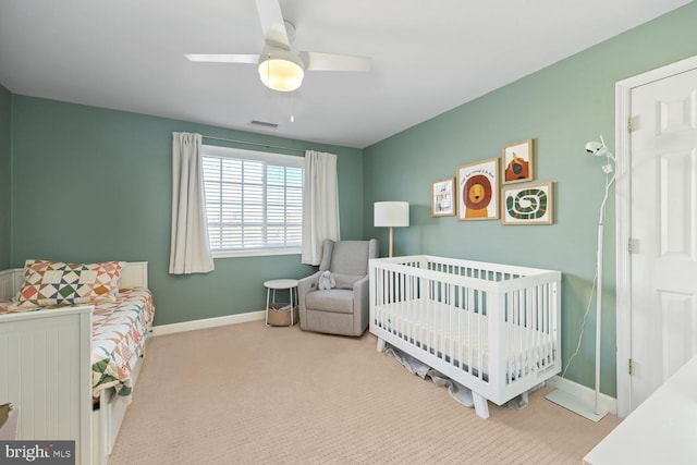 carpeted bedroom with ceiling fan