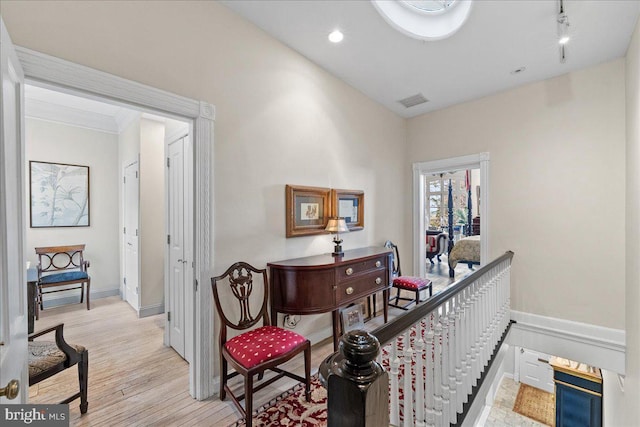 hallway with light hardwood / wood-style flooring