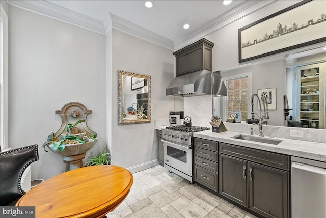 kitchen with dark brown cabinetry, sink, wall chimney exhaust hood, crown molding, and appliances with stainless steel finishes