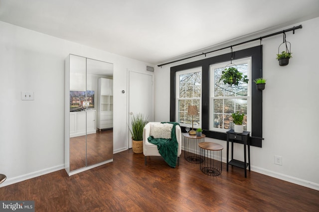 living area with dark wood-type flooring