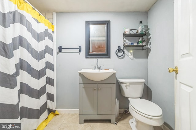 bathroom with a shower with curtain, tile patterned floors, toilet, and vanity