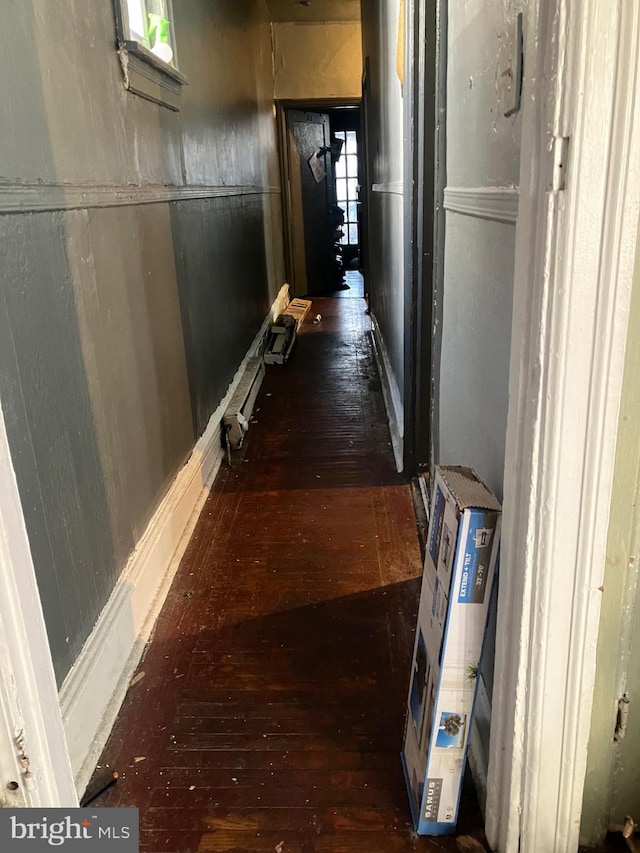 hallway featuring dark wood-type flooring