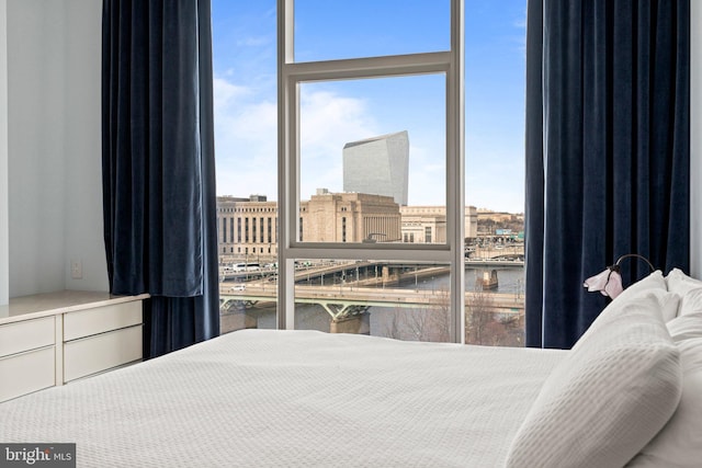 bedroom featuring a water view