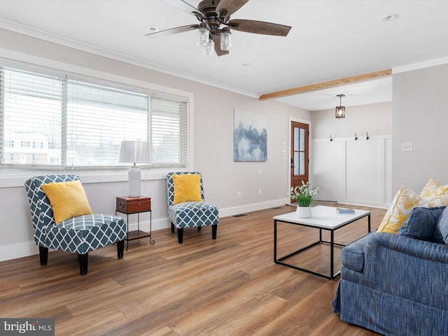 living room with ceiling fan, wood-type flooring, and crown molding