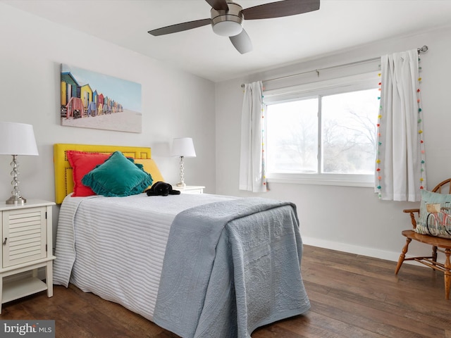 bedroom with dark hardwood / wood-style flooring and ceiling fan