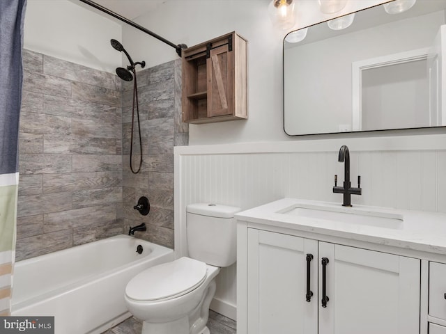 full bathroom with wood walls, vanity, tiled shower / bath combo, and toilet