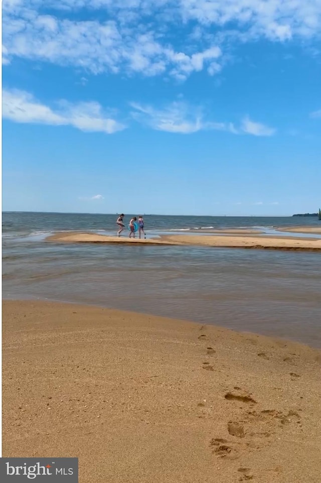 view of water feature with a beach view