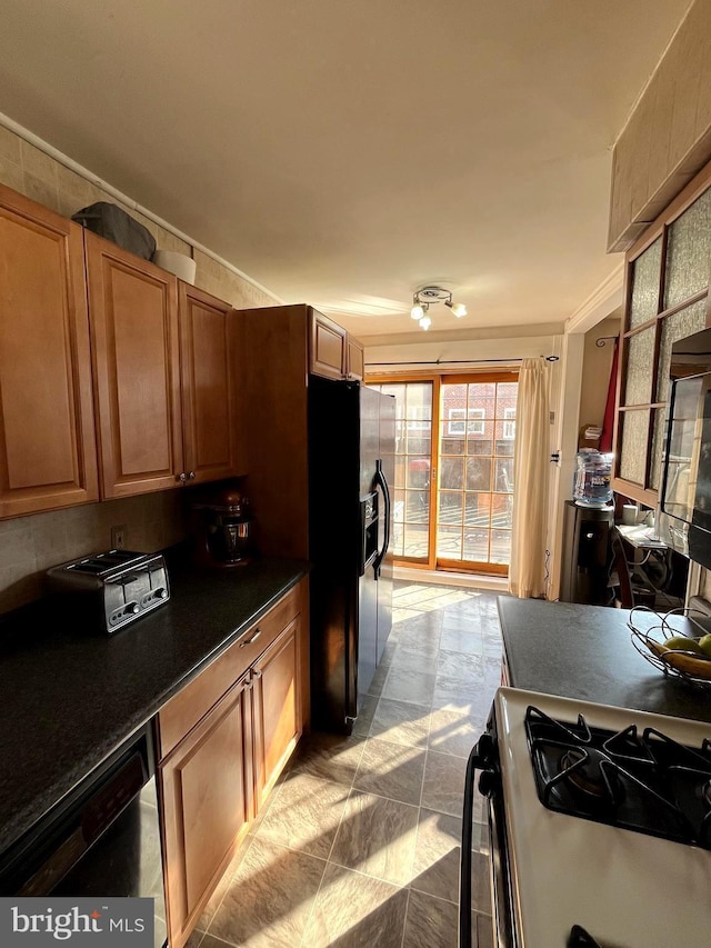 kitchen featuring black appliances and light tile patterned flooring