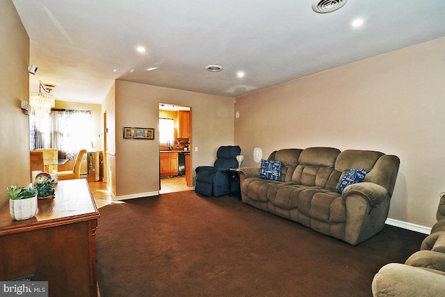 living room featuring carpet floors and sink