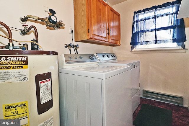 washroom featuring cabinets, separate washer and dryer, and water heater