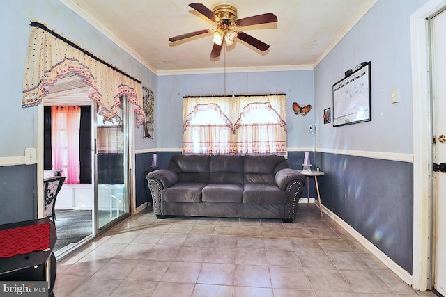 living room with tile patterned floors, ceiling fan, and ornamental molding