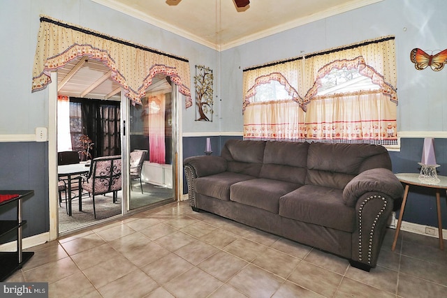 tiled living room featuring ceiling fan and ornamental molding