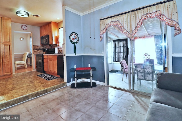 kitchen featuring decorative backsplash, crown molding, light tile patterned floors, and black appliances