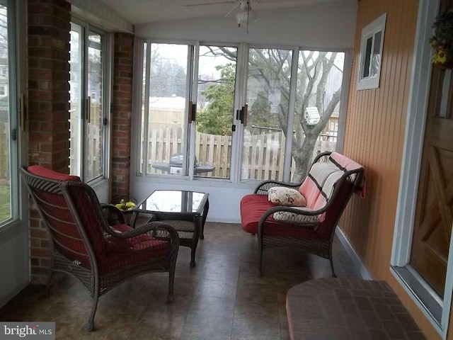 sunroom / solarium with vaulted ceiling and ceiling fan