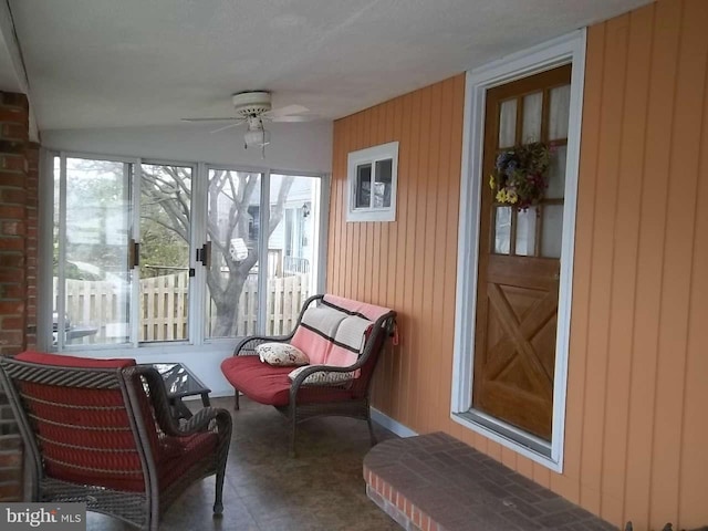 sunroom / solarium with ceiling fan