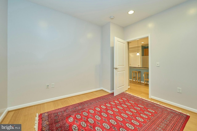 spare room featuring hardwood / wood-style floors