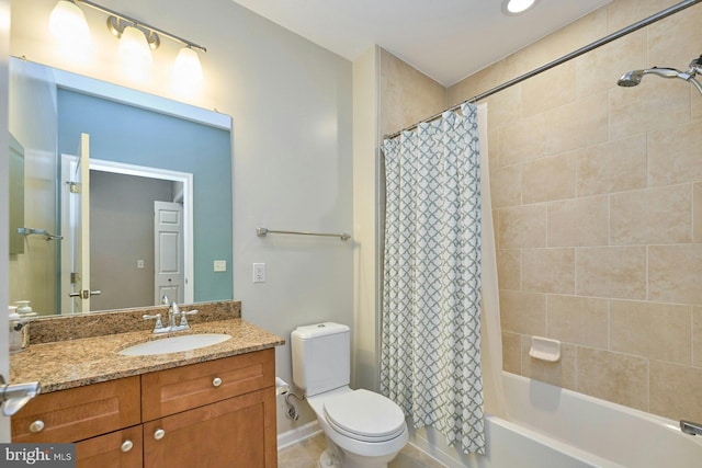 full bathroom featuring shower / bath combo, vanity, and toilet