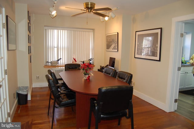 dining room featuring dark hardwood / wood-style floors and ceiling fan