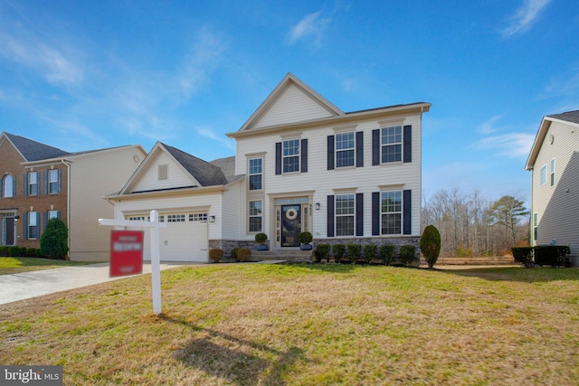 view of front of property featuring a front yard and a garage