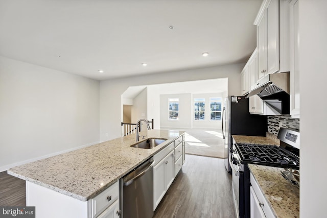 kitchen with a kitchen island with sink, sink, stainless steel appliances, and white cabinetry