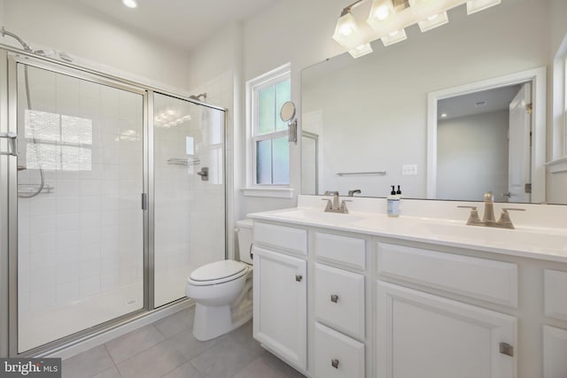 bathroom with an enclosed shower, vanity, tile patterned floors, and toilet