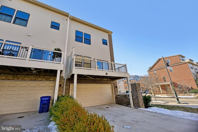 rear view of house with a garage