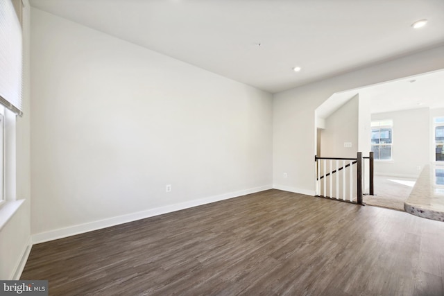 spare room featuring dark hardwood / wood-style floors