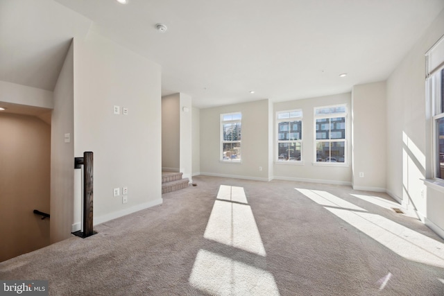 unfurnished living room with light carpet