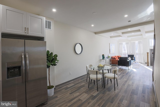 dining area featuring beam ceiling, dark hardwood / wood-style flooring, and coffered ceiling