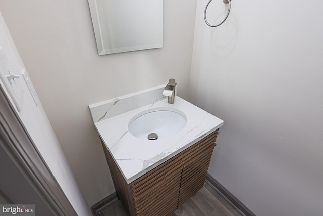 bathroom featuring vanity and hardwood / wood-style flooring