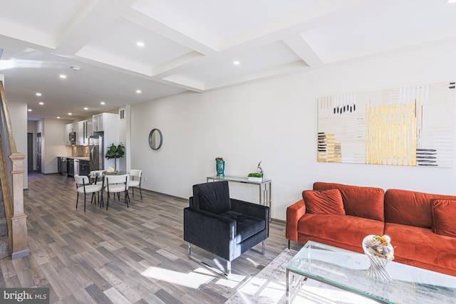 living room with beamed ceiling and wood-type flooring