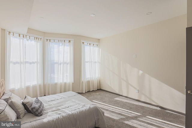 bedroom with light colored carpet