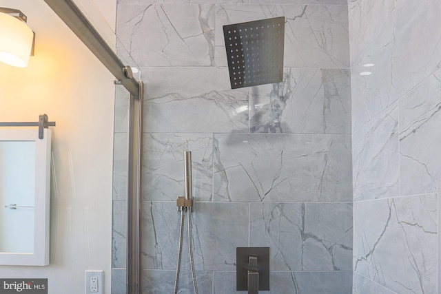 details featuring a tile shower