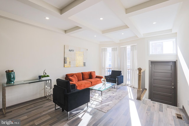 living room featuring dark hardwood / wood-style floors, beam ceiling, and coffered ceiling