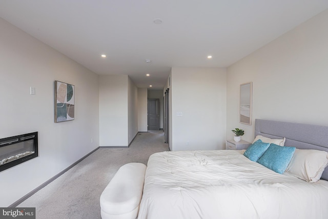 bedroom featuring light carpet