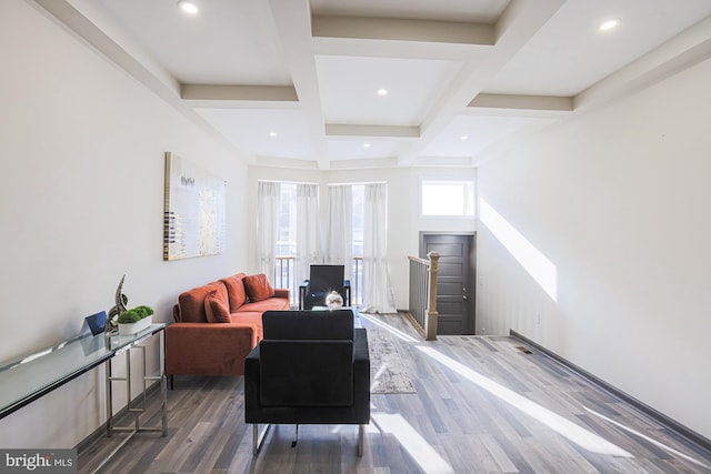 living room with coffered ceiling, beamed ceiling, and dark hardwood / wood-style floors