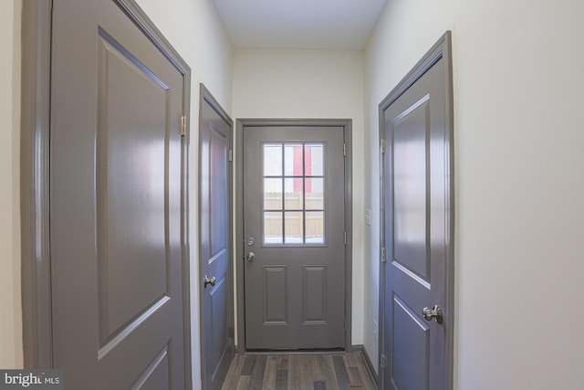 doorway to outside with dark hardwood / wood-style floors