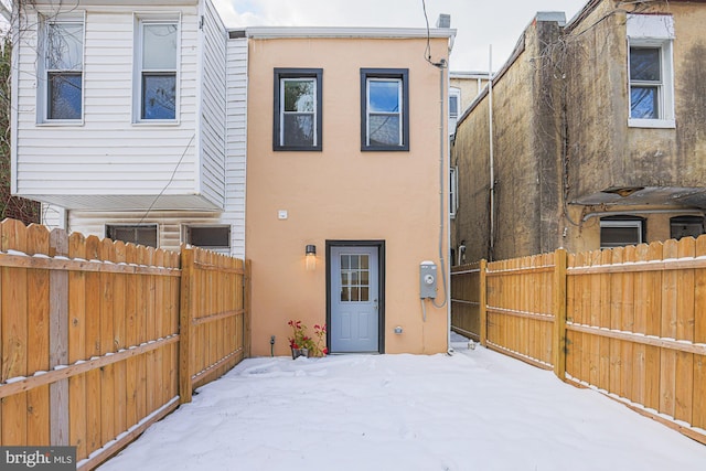 view of snow covered house