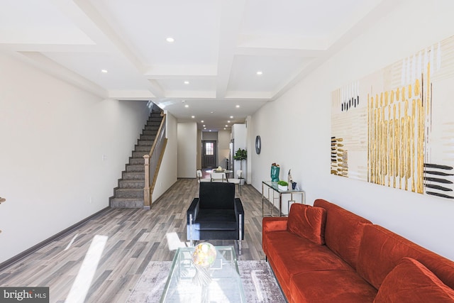 living room with beam ceiling, light hardwood / wood-style floors, and coffered ceiling