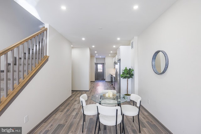 dining room with dark hardwood / wood-style flooring