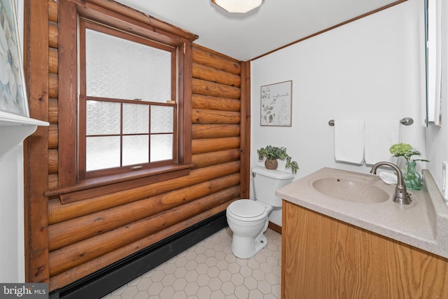 bathroom with log walls, vanity, toilet, and tile patterned flooring